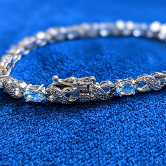 Blue Topaz and Diamond Accent Infinity Bracelet - Picture 6 of 9